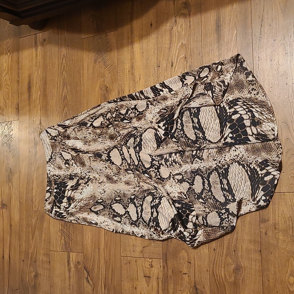 Snake print skirt. Longer in the back then in front. ZIPS AND ties in the back.